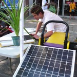 Chris Neidl sets up Solar One's photovoltaic panel demonstration